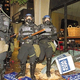 Riot police advance through downtown Miami, where clashes between Gore and Bush factions left 23 dead Monday night.